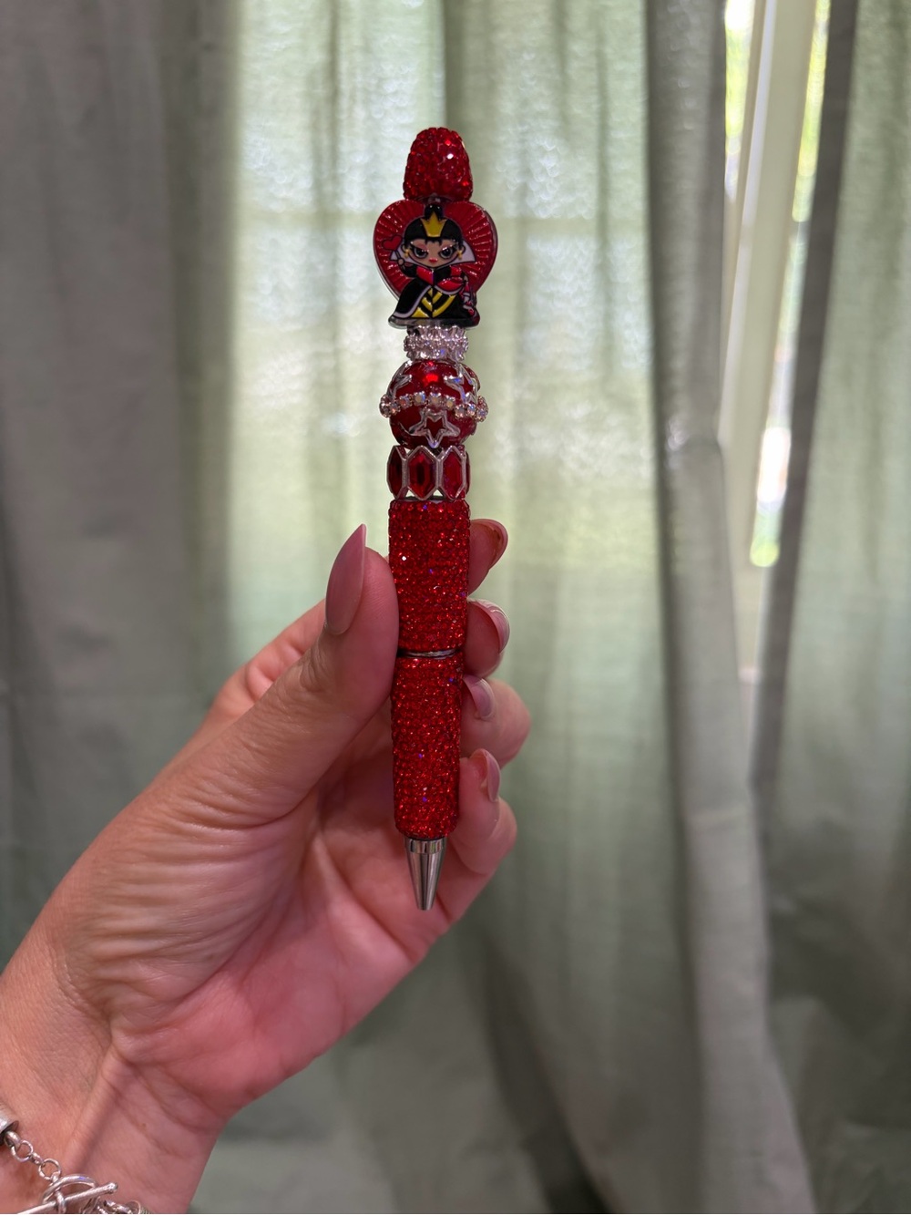 Bedazzled beaded pen with acrylic villain
